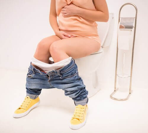 gravid kvinna på toalett